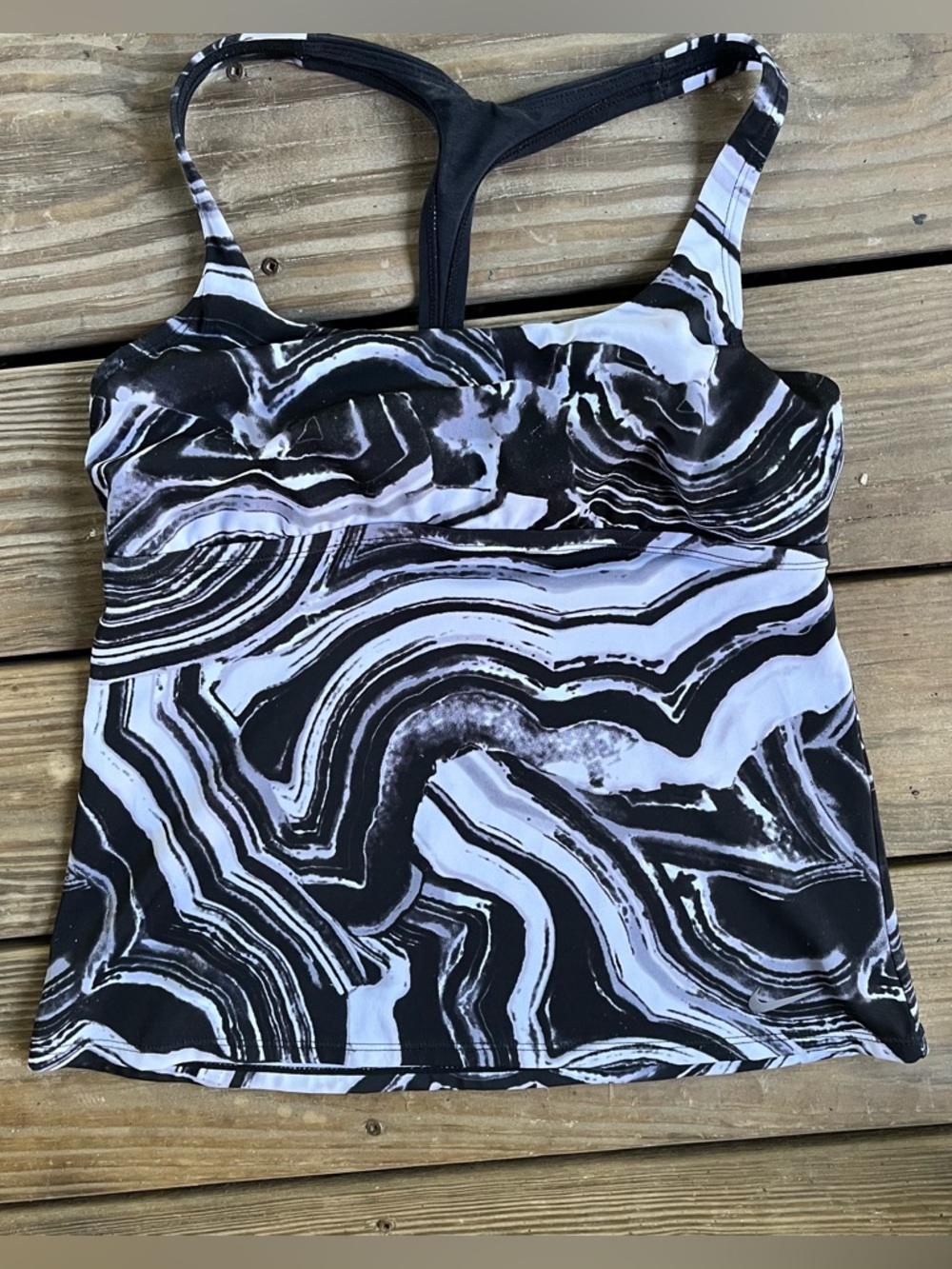 Nike Medium Surge Racerback Tankini. Stretchy for high-impact water activities.